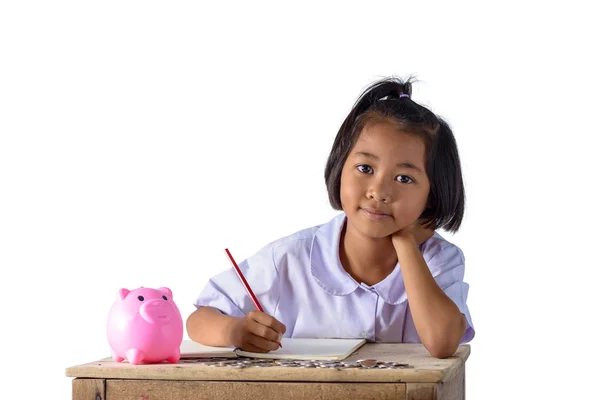 Aranyos ázsiai ország lány jegyezze fel a bevételek jövedelmet és -érmék — Stock Fotó