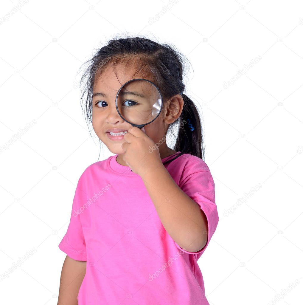 Happy kid exploring with magnifying glass isolated on white back