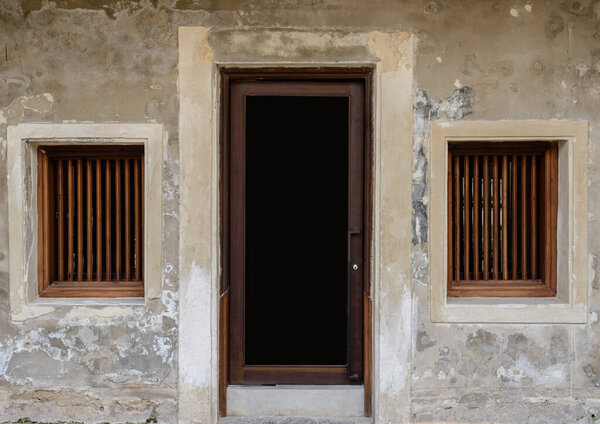 Background of old vintage traditional wooden window, door and ruins cement wall