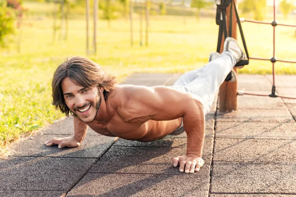 Full Length Strong Smiling Young Man Exercising Push Ups Legs — Stock Photo, Image