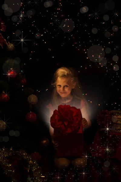 Magic Christmas Little Girl Opens Big Red Gift — Stock Photo, Image