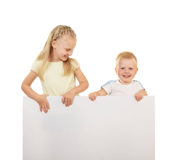 Little boy and girl smiling and holding blank banner isolated on white background