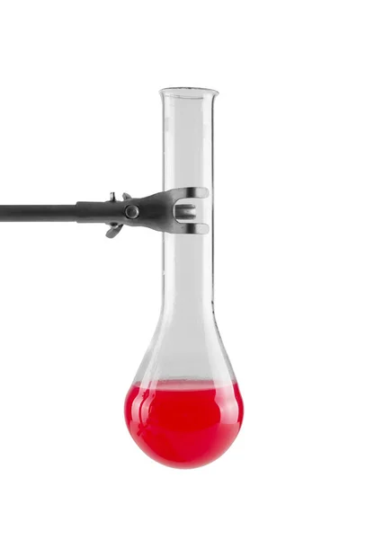 Reagent red color in round bottom flask in foot of tripod isolated on white background — Stock Photo, Image