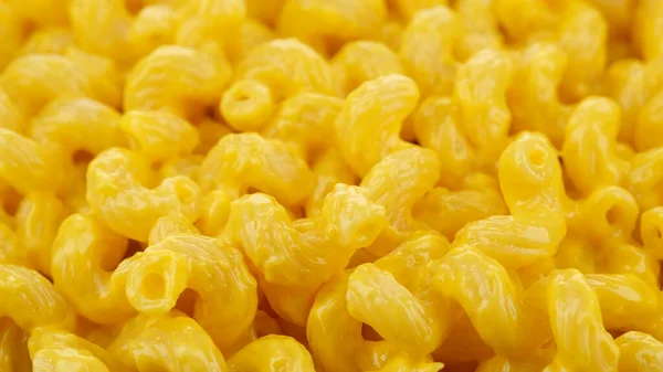 delicious yellow macaroni with cheese sauce, top view