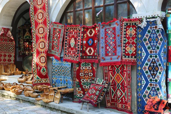 Colourful Persian carpets and rugs hanging on the wall at the market in Cappadocia.