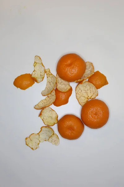 Mandarins orange skin top view. Clementine\'s peel on white background. Abstract concept. Mandarin skin.