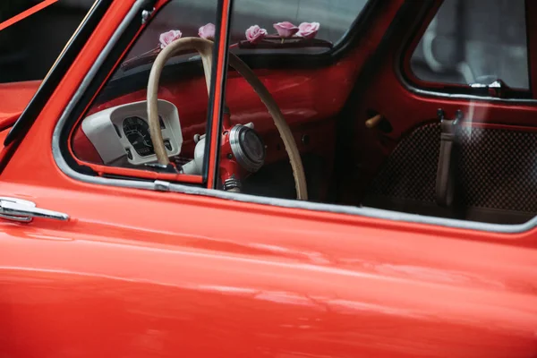 Old red car with a ribbon — Stock Photo, Image