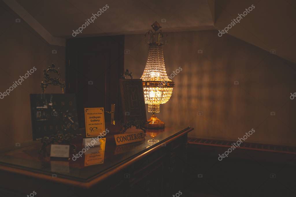 Concierge's desk with decorative lamp at the hotel