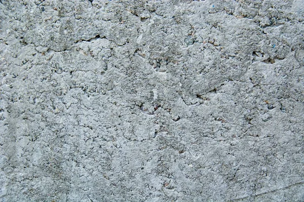 Closeup shot of naturally weathered grungy wall with oil paint leftovers on marble — Stock Photo, Image