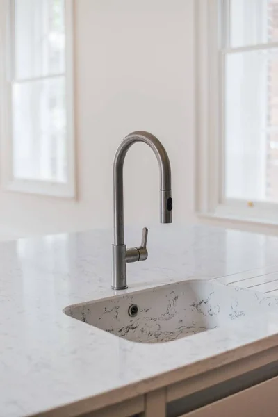 Vertical shot of a white sink in the kitchen — Stock Photo, Image