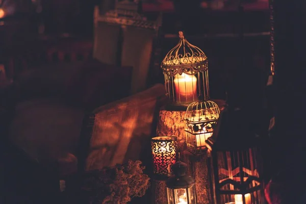 Closeup shot of a brown mental lantern with a lighted candle inside — Stock Photo, Image