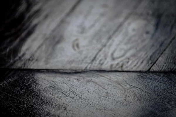 Closeup shot of a wooden surface in black and white