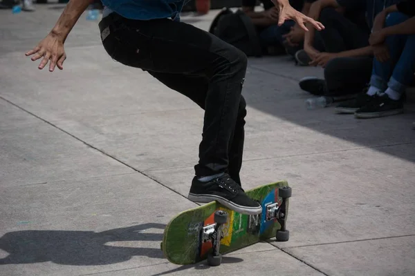 Close up at the feet of a young boy doing skateboard tricks — Stock Photo, Image