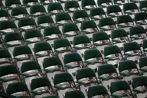 Wide shot of multiple chairs arranged in a row — Stock Photo, Image