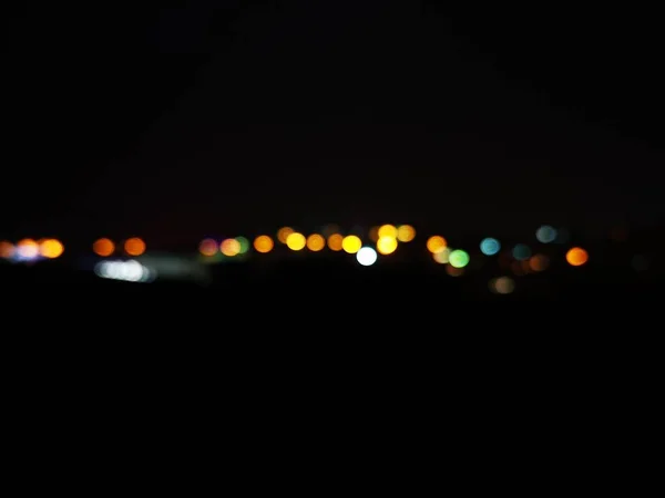 Hermoso fondo de pantalla o fondo de luces de la ciudad bokeh por la noche —  Fotos de Stock