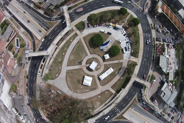 An aerial shot of an urban city road intersections