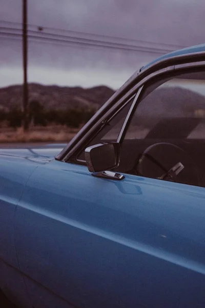 Closeup vertical shot of an old light blue pickup car's left door — Stock Photo, Image