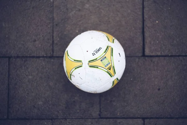 An overhead shot of a football on the ground