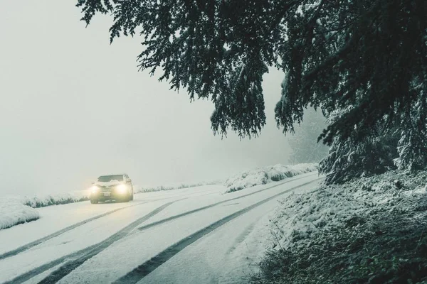 Beautiful scenery of snow-covered dangerous countryside roads