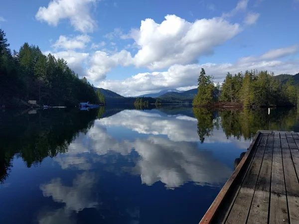 Landscape shot of a lake in Skookumchuck Narrows, Canada with the sky reflected in the clear water — 스톡 사진