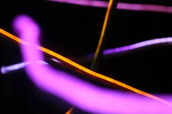 Closeup tiro de raios coloridos de luz para fundo fresco ou papel de parede — Fotografia de Stock