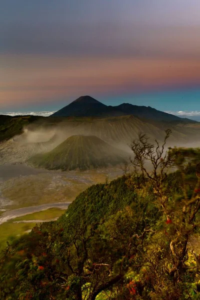 Vertical Shot Beautiful Green Mountains Bromo Volcano Indonesia Colorful Sky — Stock Photo, Image