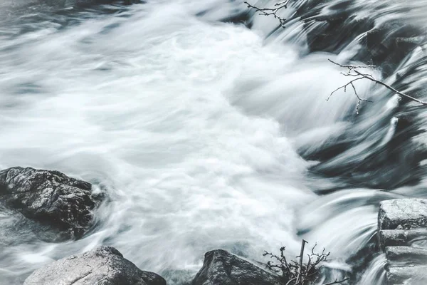 Timelapse shot of a beautiful waterfall during daytime - great for a cool background — Stock Photo, Image