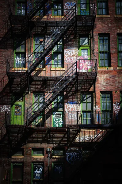 Vertical shot of a fire escape with modern wall art in Boston, Massachusetts