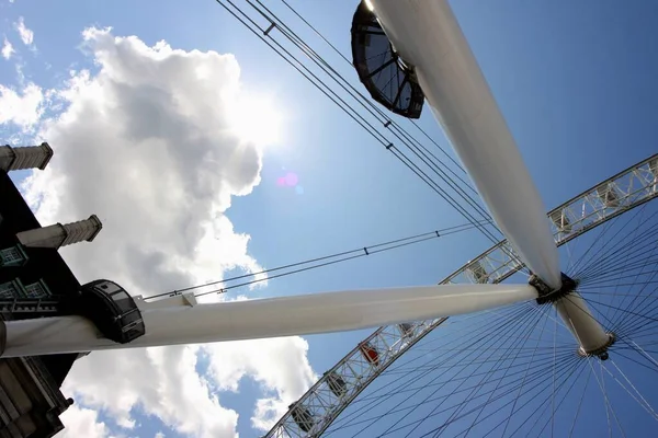 Low angle shot of a merry go round and a beautiful cloudy sky — Stock Photo, Image