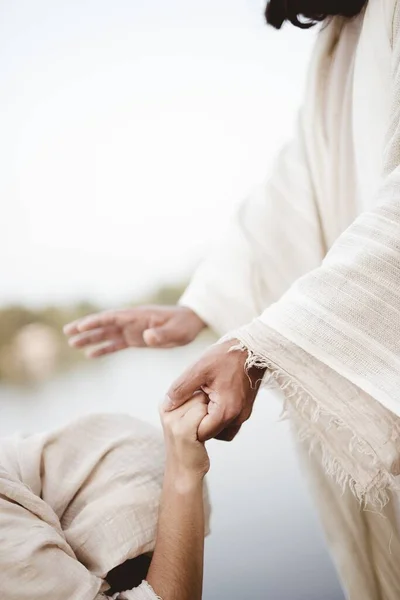 Biblical scene - of Jesus Christ healing the female with a blurred background — kuvapankkivalokuva