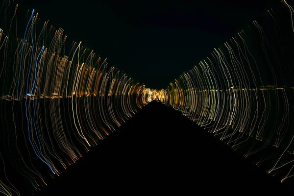 Gyönyörű lineáris fények egy fekete háttér — Stock Fotó