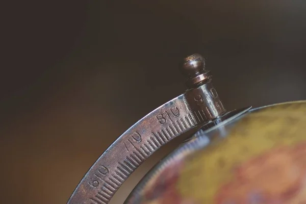 Closeup shot of a desk globe with a blurred background — ストック写真