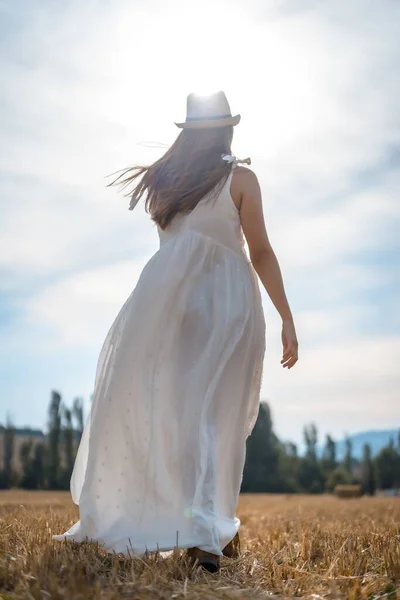 Vertical Shot Cheerful Female White Dress Running Field Sunlight — Stock Photo, Image