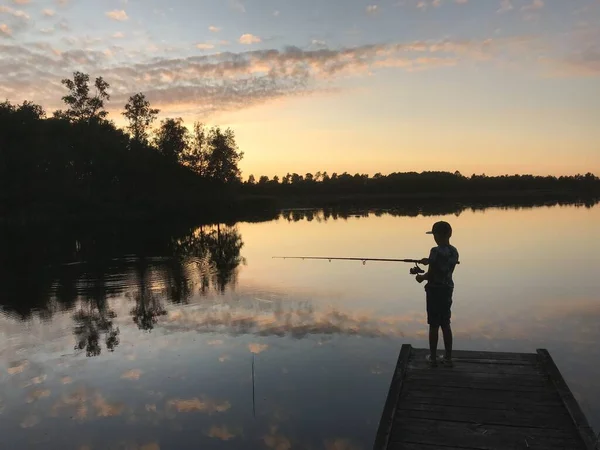 Person Fishing Lake Surrounded Trees Sunset — Stock Photo, Image