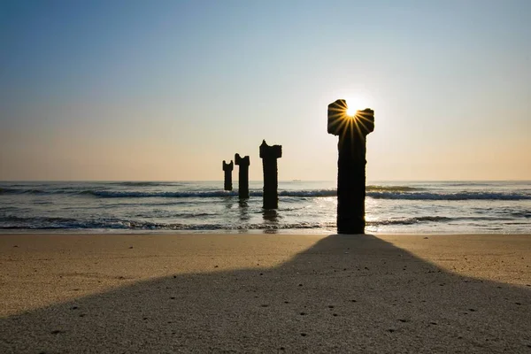 Amazing Shot Metal Columns Sandy Beach — Stock Photo, Image