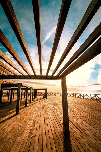 A terrace with fence, floor and canopies made of wood and with a view to the sea — Stock Image Terrace Fence Floor Canopies Made Wood View Sea Stock Picture