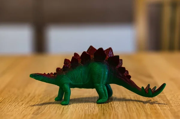 Closeup Shot Small Plastic Dragon Toy Wooden Table — Stock Photo, Image