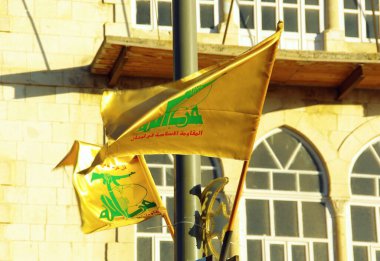 Flag of Hezbollah on a post in Baalbek, Lebanon clipart