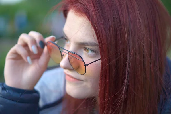 Portrait Red Haired Female Holding Her Sunglasses Her Eyes While — Stock Photo, Image