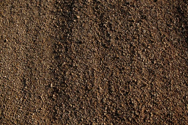 Hintergrund Einer Braunen Oberfläche Mit Vielen Winzigen Steinen — Stockfoto