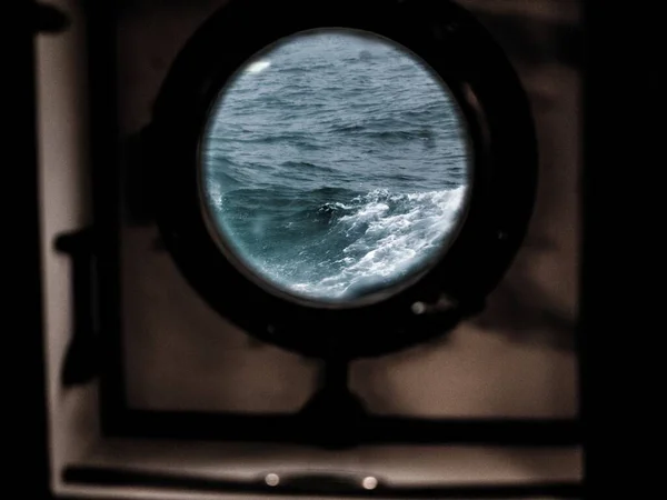 Ship Window Brown Edges Wavy Sea Seen — Stock Photo, Image