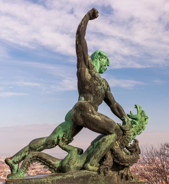 A sculpture of a man drowning a dragon in Gellrthegy Budapest Hungary