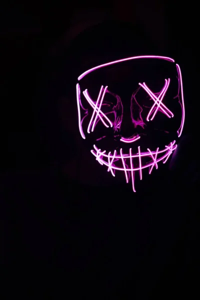 The person with pink led mask for partying