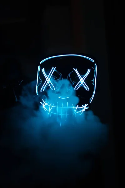 A man with blue led mask for partying