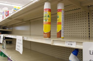 MIDDLETOWN, NY, UNITED STATES - May 06, 2020: Bare Shelves show Essential Cleaning Products are Nearly Sold Out at Big Lots during COVID-19 Pandemic due to fear and hoarding / bulk buying. clipart