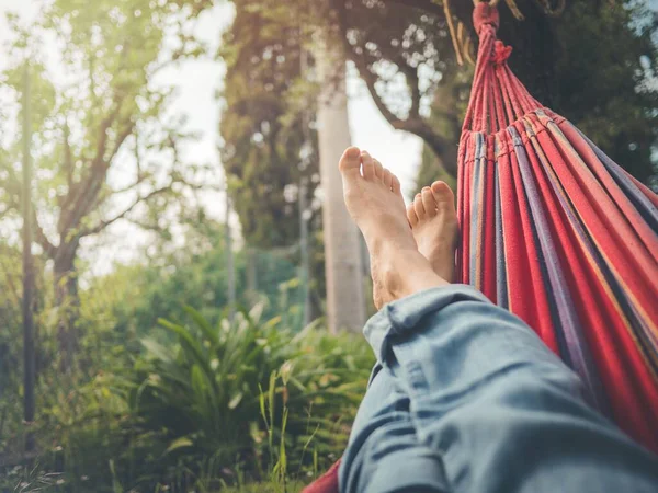 Barefoot Man Blue Jeans Lying Red Hammock Some Trees Background — Stock Photo, Image