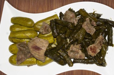 Grape vine leaves,zucchini, stuffed with rice and meat ,a traditional Mediterranean countries dish it's called in turkey (Sarma) and in Arabic mahashy clipart