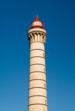 PORTO, PORTUGAL - May 27, 2020: Lighthouse with clear blue sky at Lea da Palmeira, Porto, Portugal  clipart