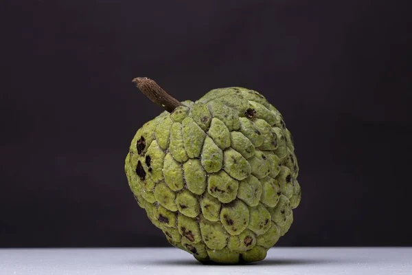 Closeup Shot Full Sugar Apple White Surface Black Background — Stock Photo, Image