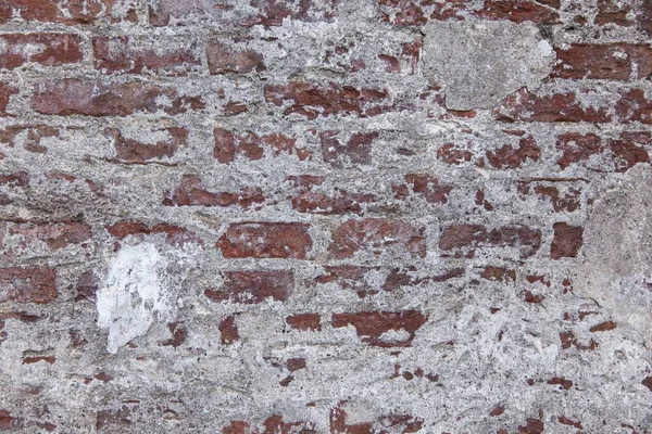 Üzerinde Biraz Alçı Doku Olan Kırmızı Beyaz Bir Taş Duvarın — Stok fotoğraf